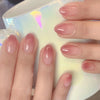 Close-up of press on with pink nail gelish with almond shape
