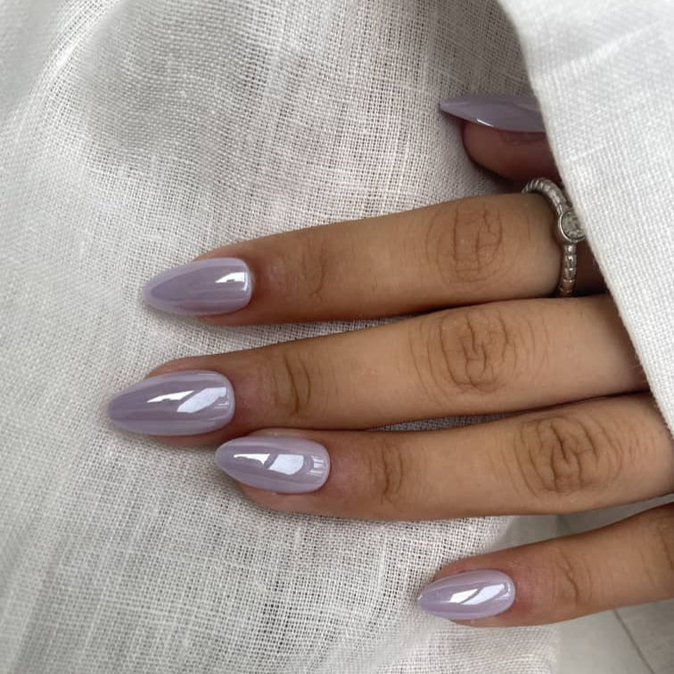 Glossy mauve press-on nails in a soft purple tone with a smooth finish