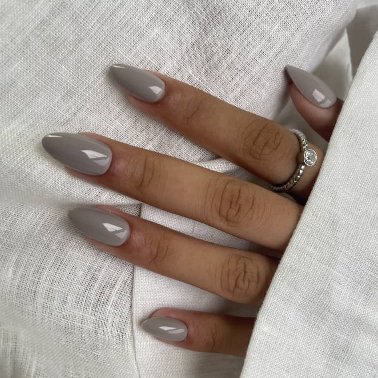 Glossy greyscape press-on nails in a sleek almond shape with a smooth finish