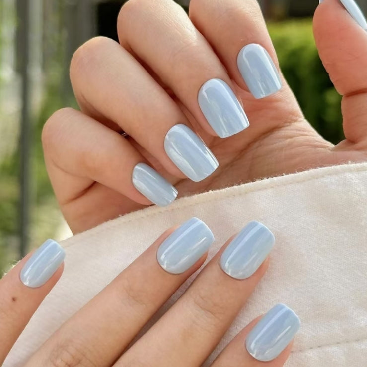 Glossy light blue press-on nails with a smooth summer-ready finish