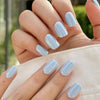 Glossy light blue press-on nails with a smooth summer-ready finish