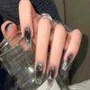 Long square deep Black glossy press-on nails – Midnight Magic set from Impress Me Beirut.